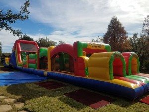 65 foot obstacle course colorful on grass in sunlight outside