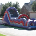 wild wave water slide on street in the sun