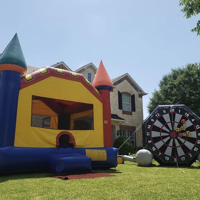 medieval infltable bounce house and soccer dart inflatable