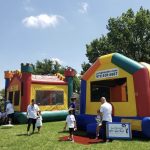 two bounce castles side by side on grass medieval bounce house jump house and colorful jump house