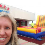 Velcro wall inflatable rental at an event with a kid on it