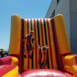 Velcro wall inflatable rental with 2 kids jumping