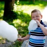kid eating cotton candy