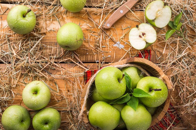 green granny apples on a table