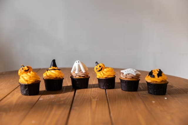 Halloween decorated cupcakes on a wooden table