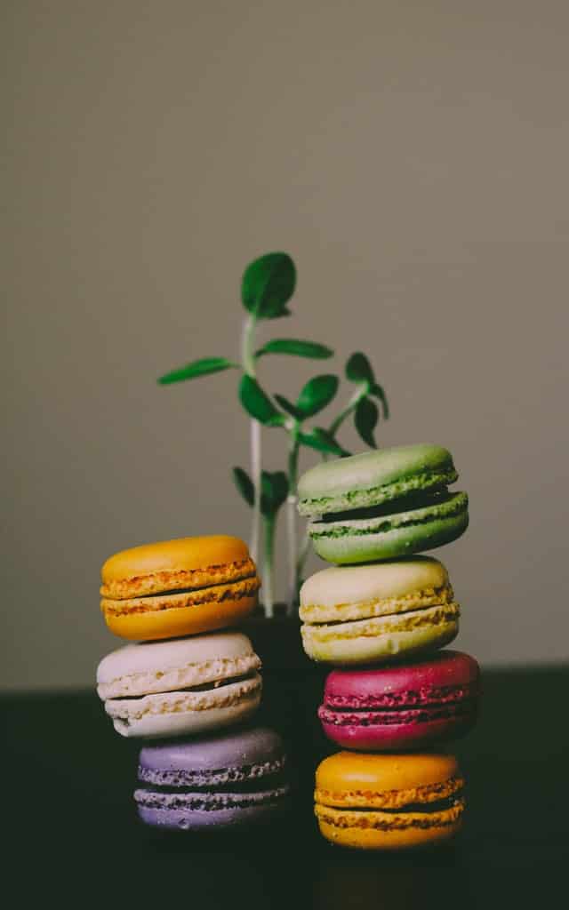 pile of macaron desserts on a table