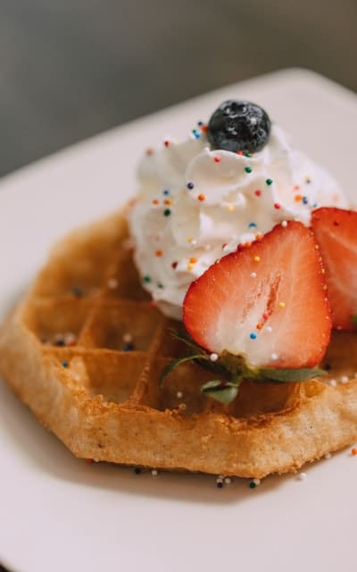 waffle dessert with whipped cream and fruit