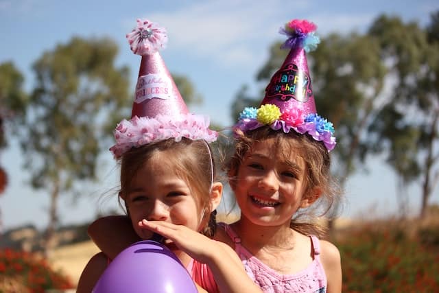 little girls with birthdayCredit: Victoria Rodriguez on Unsplash party hats